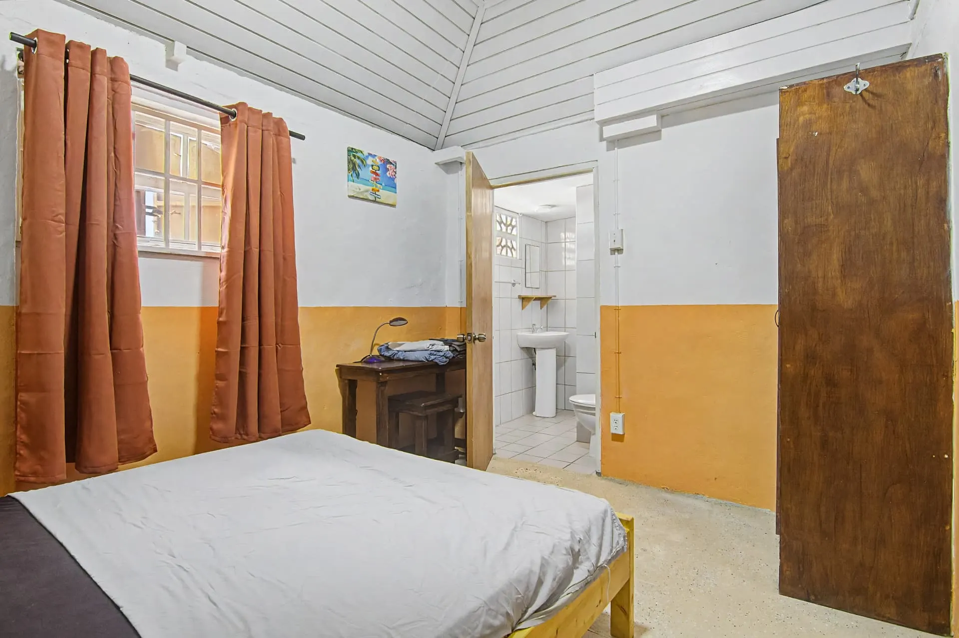 Casa 2 private studio bedroom with double bed and en-suite bathroom view
