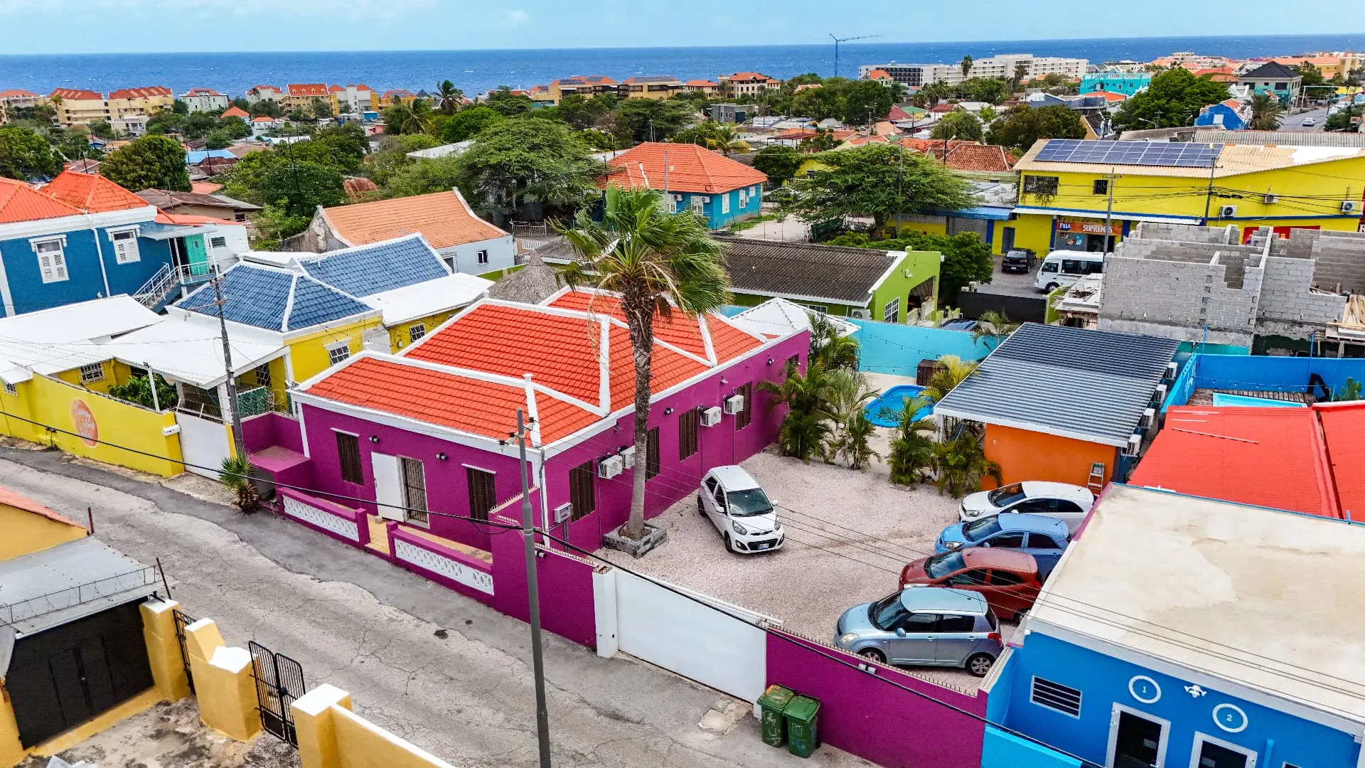 Aerial view of Casa 7 student housing with the Caribbean coast behind it