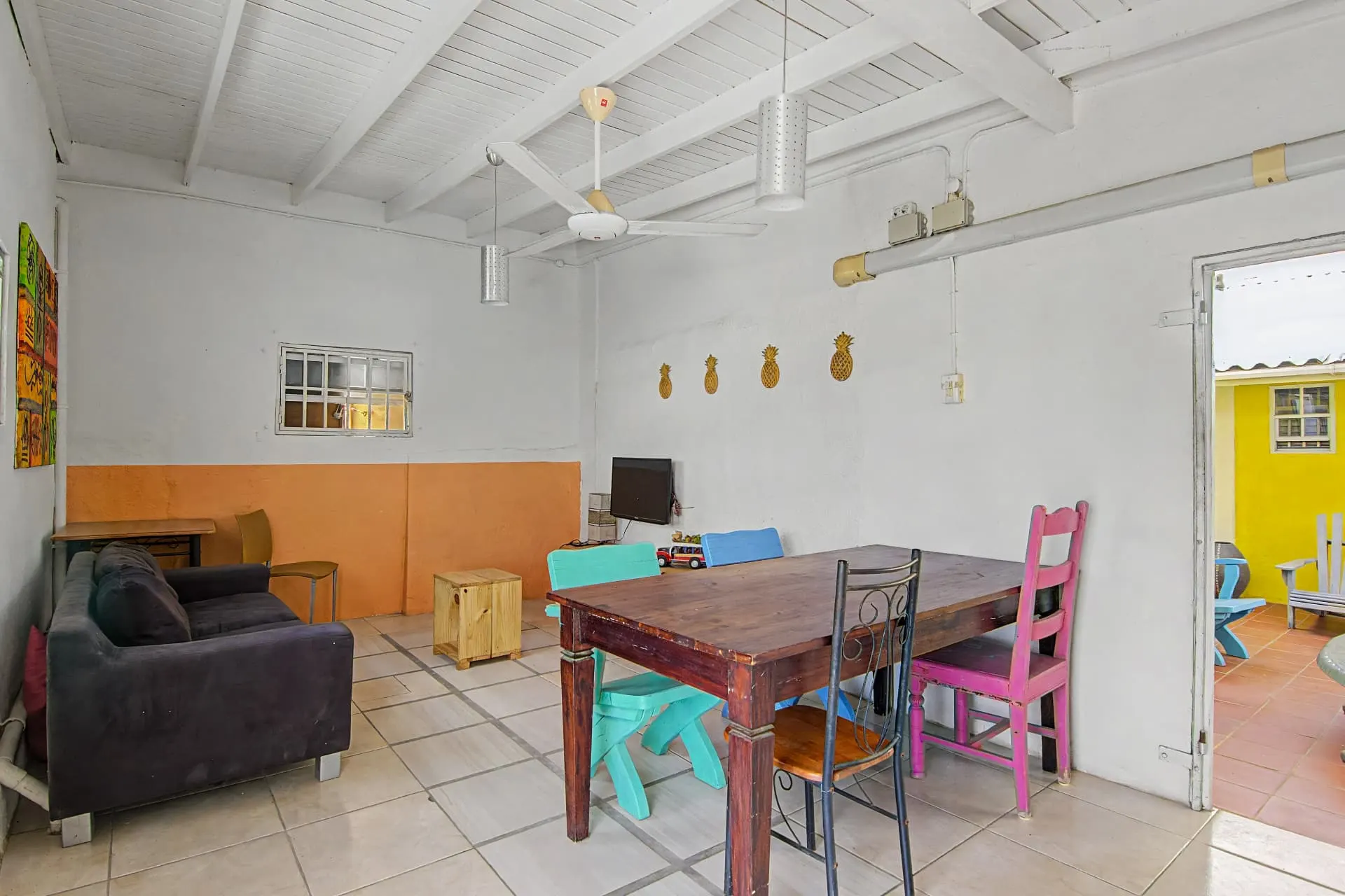 Casa 2 shared lounge with sofa and dining table